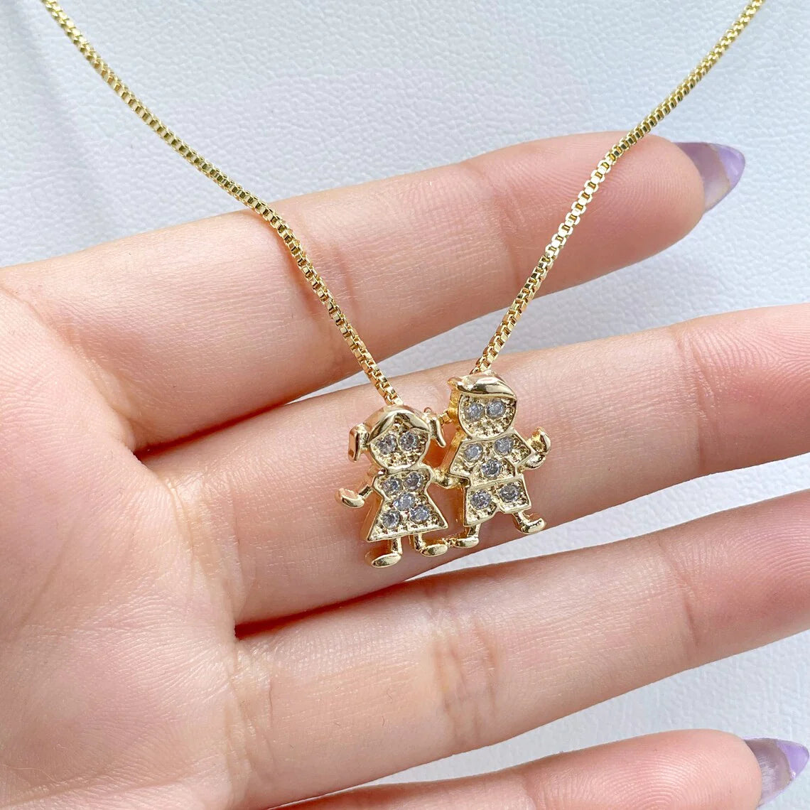 Chain and Pendant Set. Box Link Chain with Boy and Girl Pendant in Cubic Zirconia 18k Gold Filled. Bundle and Save. FREE SHIPPING on orders of $100 and over. Sam's Jewelry World USA.